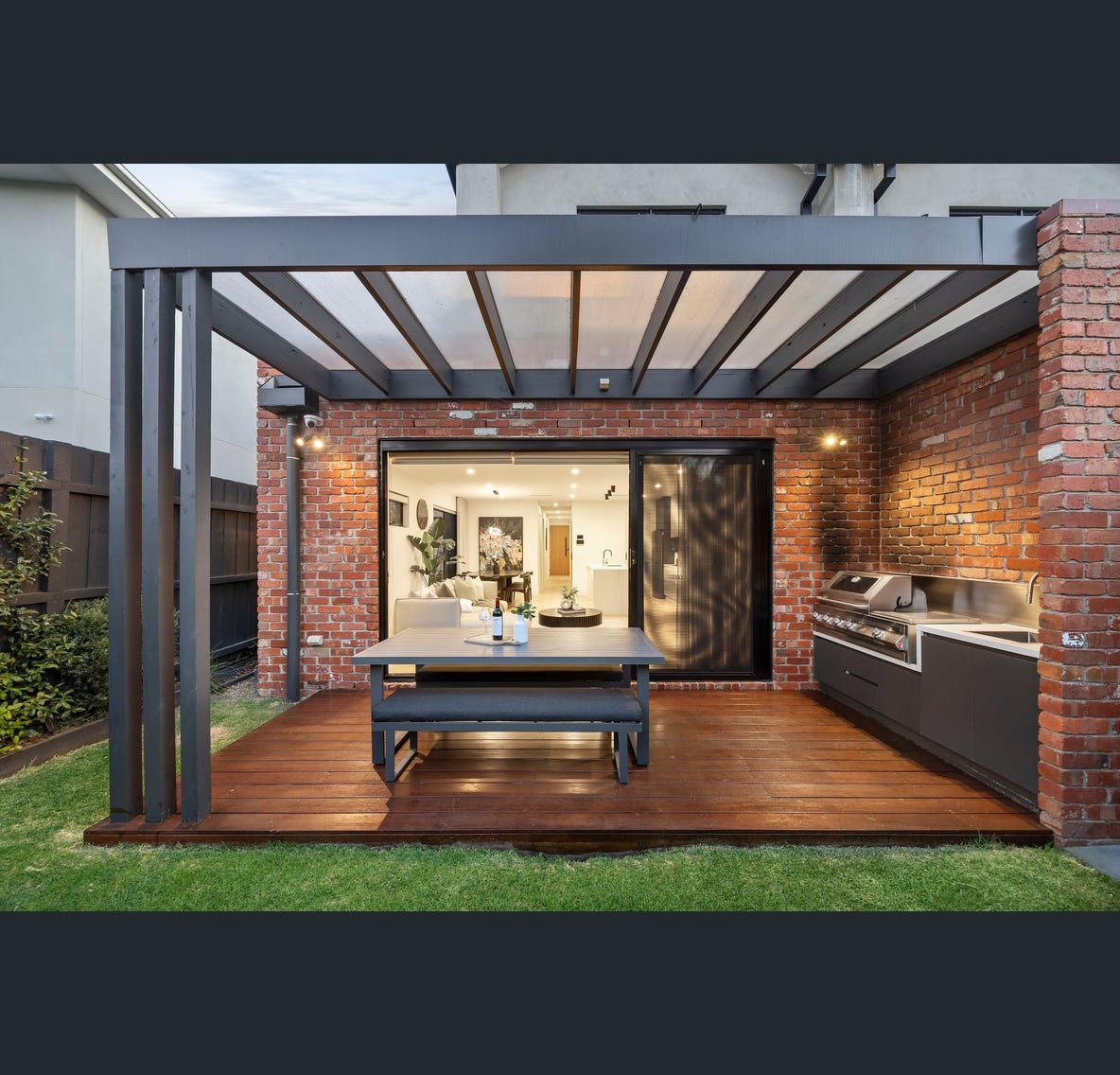 Alfresco — pergola & garden at dusk